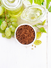 Image showing Flour grape seed in bowl on light board top