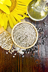 Image showing Flour sunflower in bowl with flower on board top