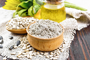 Image showing Flour sunflower in bowl with oil on burlap