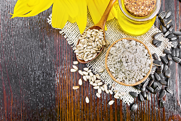 Image showing Flour sunflower in bowl with seeds on dark board top