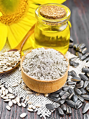 Image showing Flour sunflower in bowl with seeds on dark board