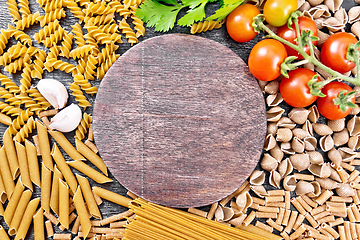 Image showing Frame different whole grain and rye pasta on dark board