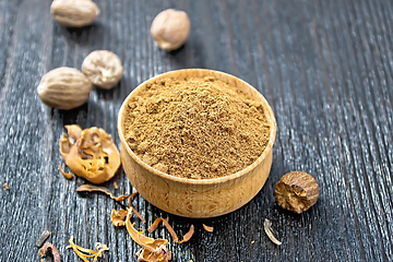 Image showing Nutmeg ground in bowl on wooden table