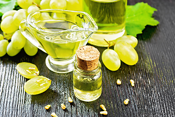 Image showing Oil grape in vial on table