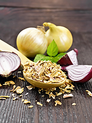 Image showing Onion flakes in spoon on board