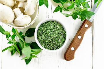 Image showing Oregano dried in bowl on board top