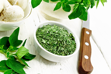 Image showing Oregano dried in bowl on wooden table