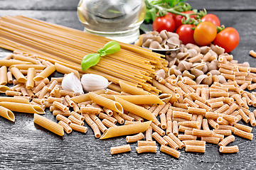 Image showing Pasta different whole grain and rye on wooden board