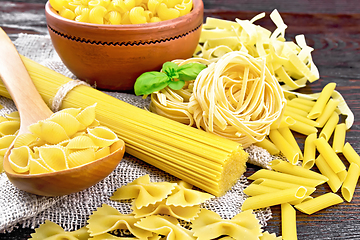 Image showing Pasta different with basil on board