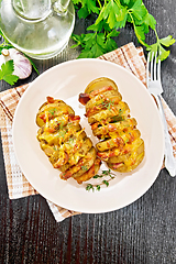 Image showing Potatoes with smoked bacon in plate on board top