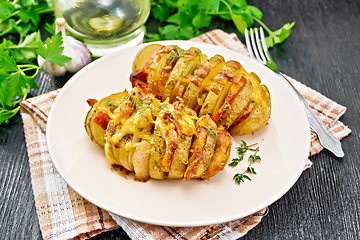 Image showing Potatoes with smoked bacon in plate on wooden board