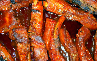 Image showing Barbecue ribs being cooked.