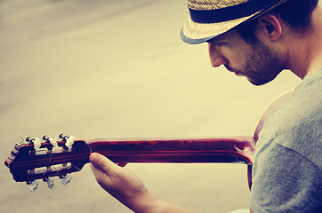 Image showing Man plays the guitar