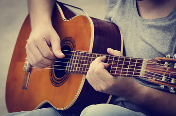 Image showing Man plays the guitar