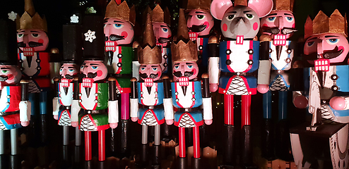 Image showing Wooden nutcracker statues standing in a row as a Christmas decor