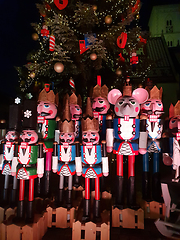 Image showing Wooden nutcracker statues standing in a row as a Christmas decor