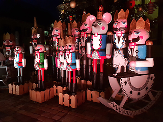 Image showing Wooden nutcracker statues standing in a row as a Christmas decor