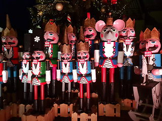 Image showing Wooden nutcracker statues standing in a row as a Christmas decor