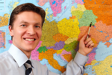 Image showing Businessman pointing on the map