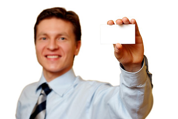 Image showing Businessman holding a white card,clipping path included