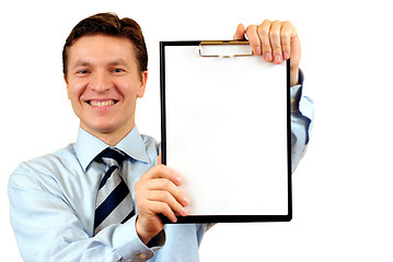 Image showing Businessman holding a blank clipboard,clipping path included