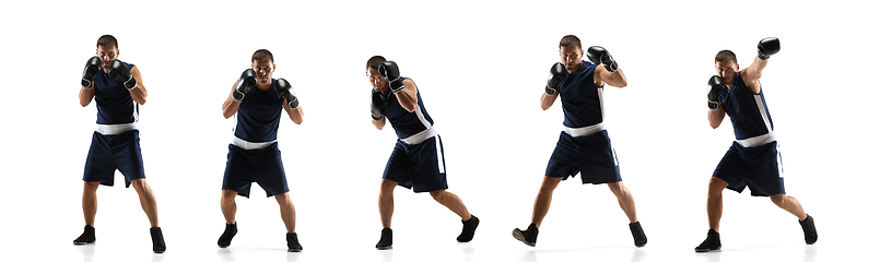 Image showing Young boxer against white studio background in motion of step-to-step kicking