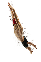 Image showing Caucasian professional sportsman, swimmer training isolated on white studio background