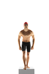 Image showing Caucasian professional sportsman, swimmer training isolated on white studio background