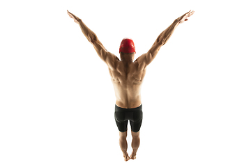 Image showing Caucasian professional sportsman, swimmer training isolated on white studio background