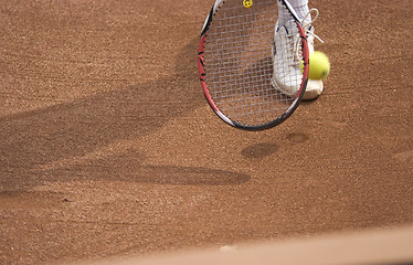 Image showing Tennis racket and ball