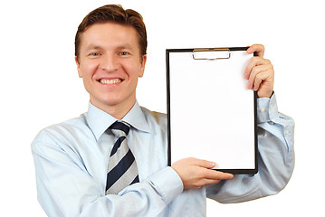 Image showing Businessman holding a blank clipboard,clipping path included