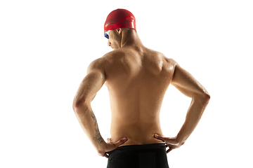 Image showing Caucasian professional sportsman, swimmer training isolated on white studio background