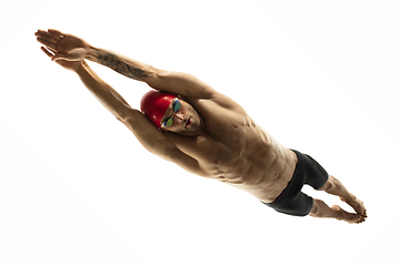 Image showing Caucasian professional sportsman, swimmer training isolated on white studio background