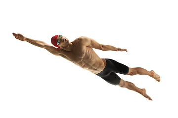 Image showing Caucasian professional sportsman, swimmer training isolated on white studio background