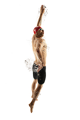 Image showing Caucasian professional sportsman, swimmer training isolated on white studio background