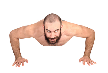 Image showing Man with beard doing push ups on the floor