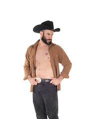 Image showing Young man with open shirt and cowboy hat