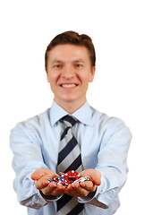 Image showing Businessman holding gambling chips,clipping path