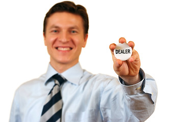 Image showing Businessman holding a dealer sign,clipping path included