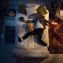 Image showing Portrait of a businessman, accountant sleeping in the bed at home