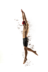 Image showing Caucasian professional sportsman, swimmer training isolated on white studio background