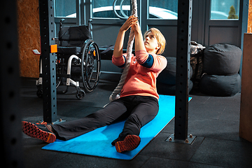 Image showing Disabled woman training in the gym of rehabilitation center