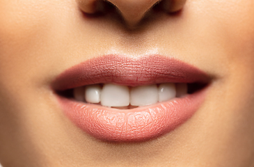 Image showing Close-up shoot of beautiful female lips with natural lipstick make up