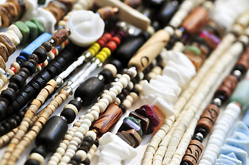 Image showing Wood and seashell bead necklaces