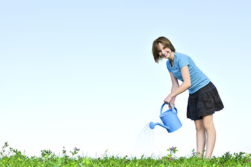 Image showing Girl with watering can