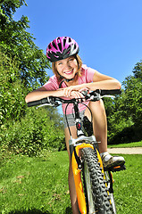 Image showing Teenage girl on a bicycle