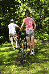 Image showing Family on bicycles