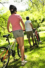 Image showing Family on bicycles