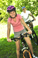 Image showing Family on bicycles