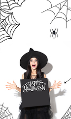 Image showing Young woman a witch on scary background
